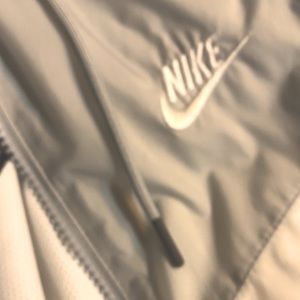Silver and white NikeTech windbreaker